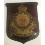 An early 20th Century plaque with leather embossed decoration inscribed "Royal Army Ordnance Corps