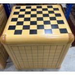 An Alison Henry game cube, each side printed with various games boards including backgammon, chess,