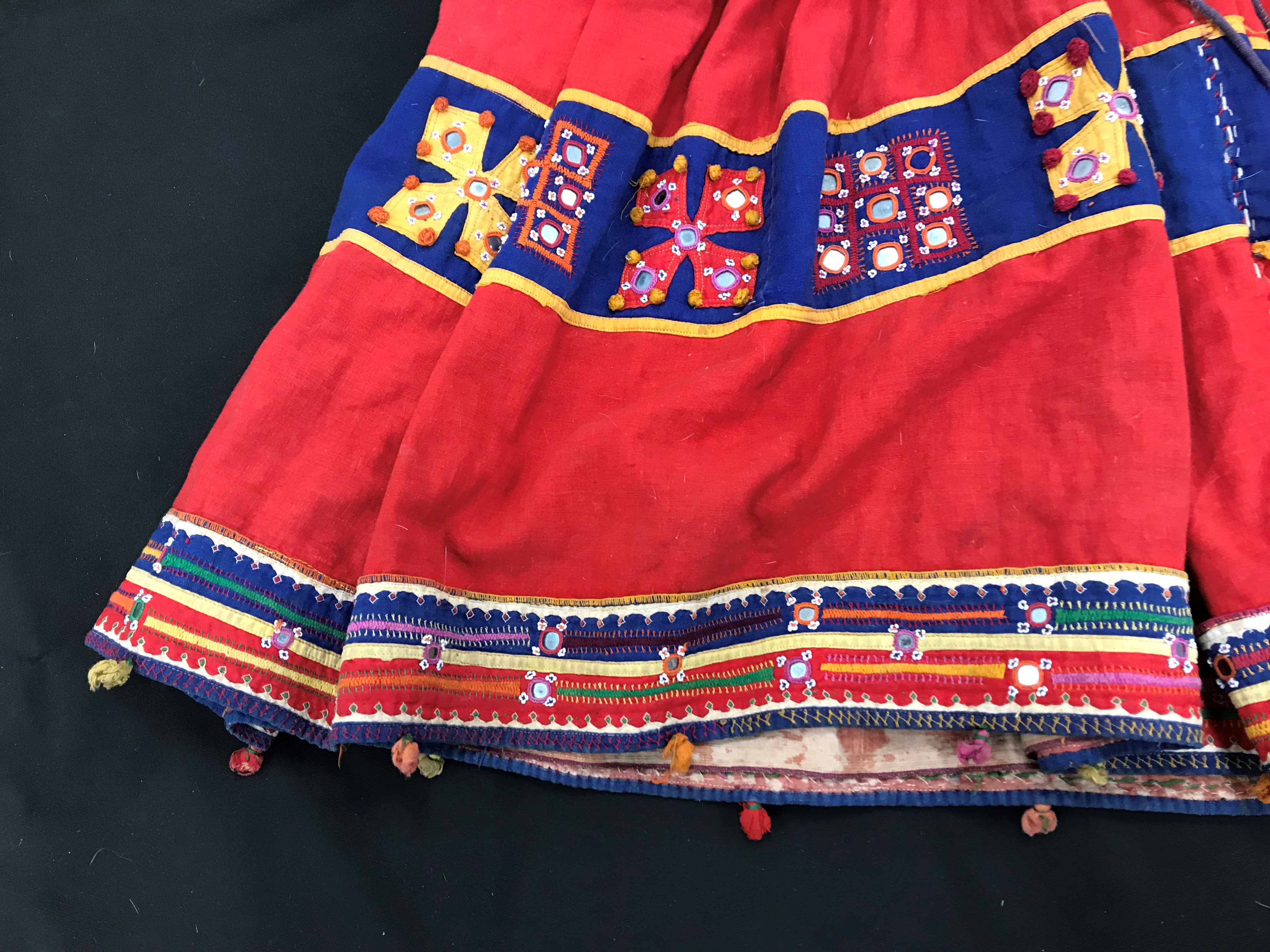A Rajhistani skirt in red and blue stripes with overlaid embroidery and mirrored decorations, - Image 10 of 14