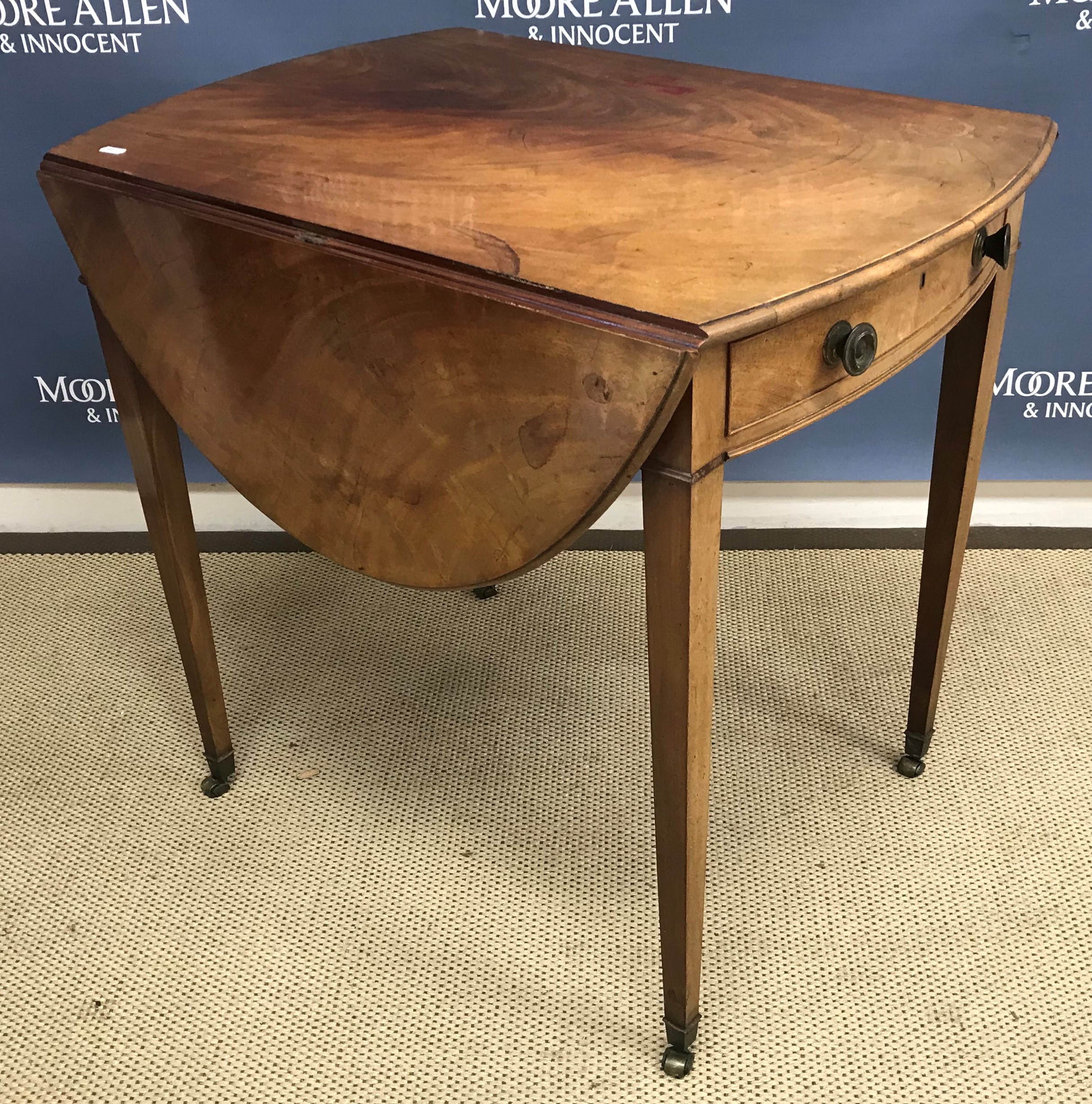 A 19th Century mahogany oval drop-leaf Pembroke table,