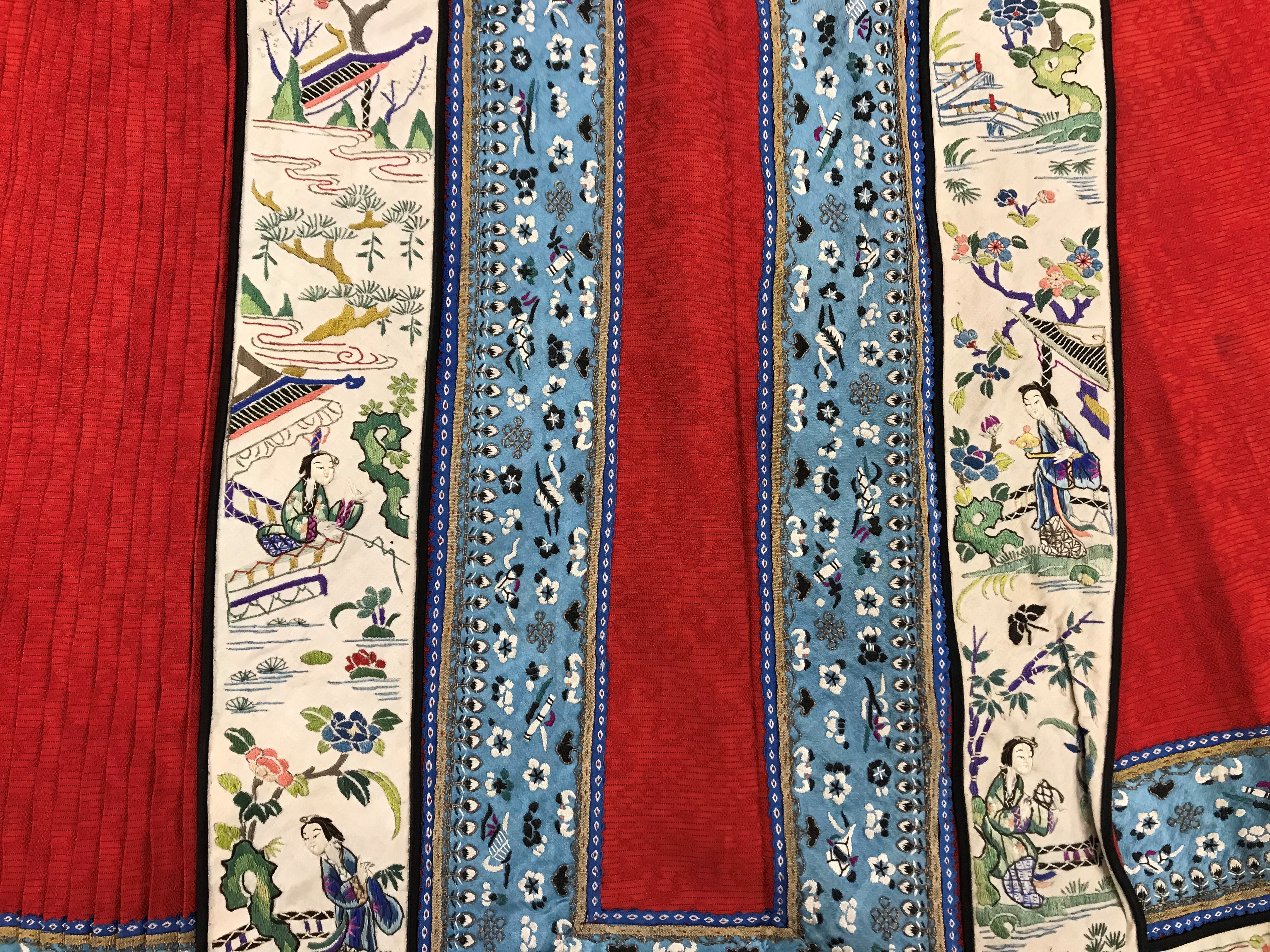 A Chinese red finely pleated silk skirt with blue and cream overlaid silk bands heavily embroidered - Image 14 of 31