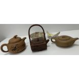 Three various Chinese Yi Xing teapots including a square form teapot with figural decoration and