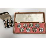 A set of eight ceramic buttons,