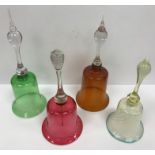 A collection of seven coloured glass table bells,