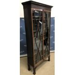 An Edwardian mahogany display cabinet in the Chippendale revival taste,