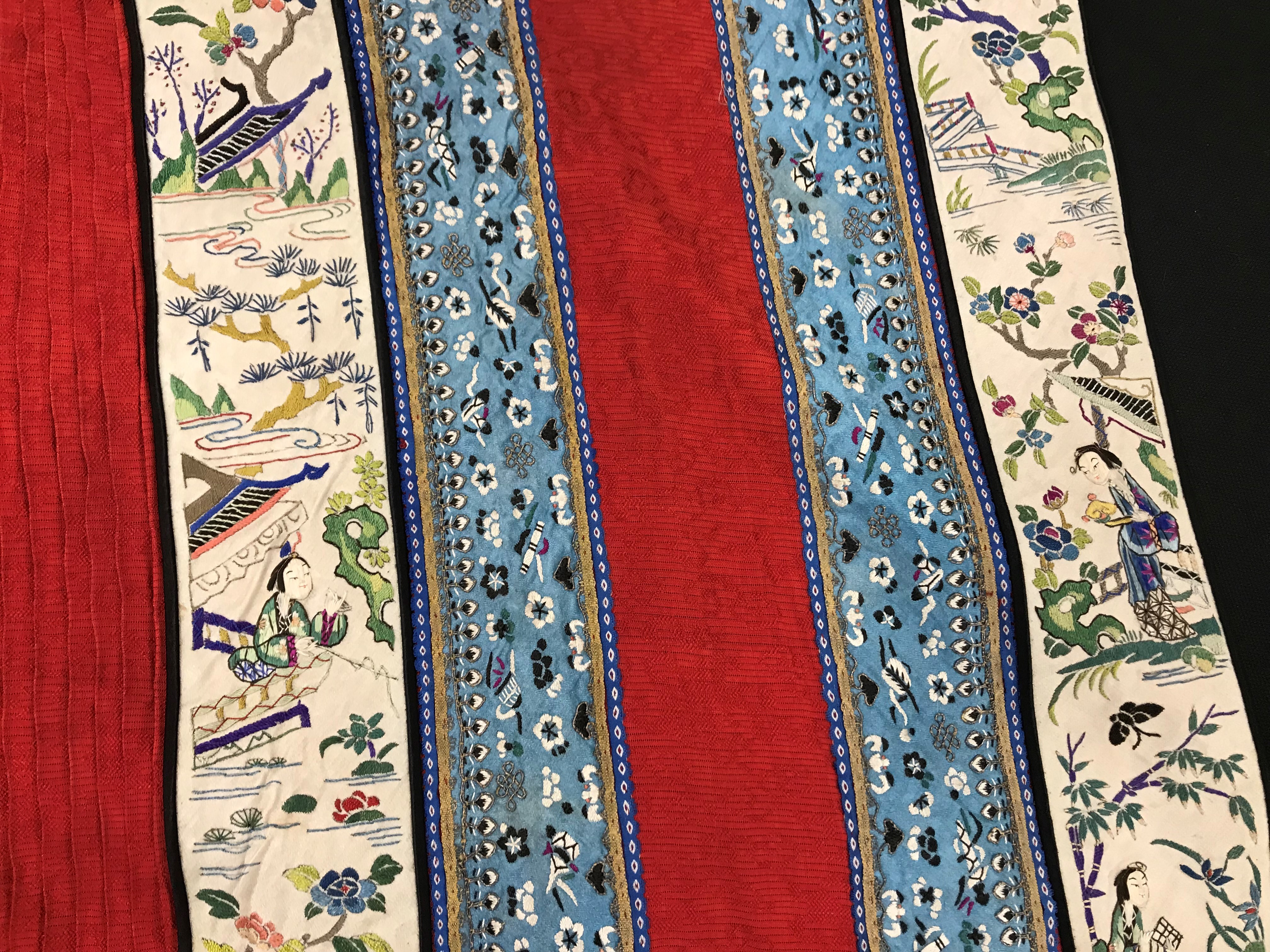 A Chinese red finely pleated silk skirt with blue and cream overlaid silk bands heavily embroidered - Image 26 of 31