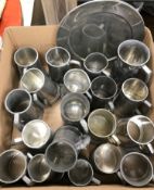 Two boxes of various pewter mugs and goblets, plated mugs, two pewter plates,