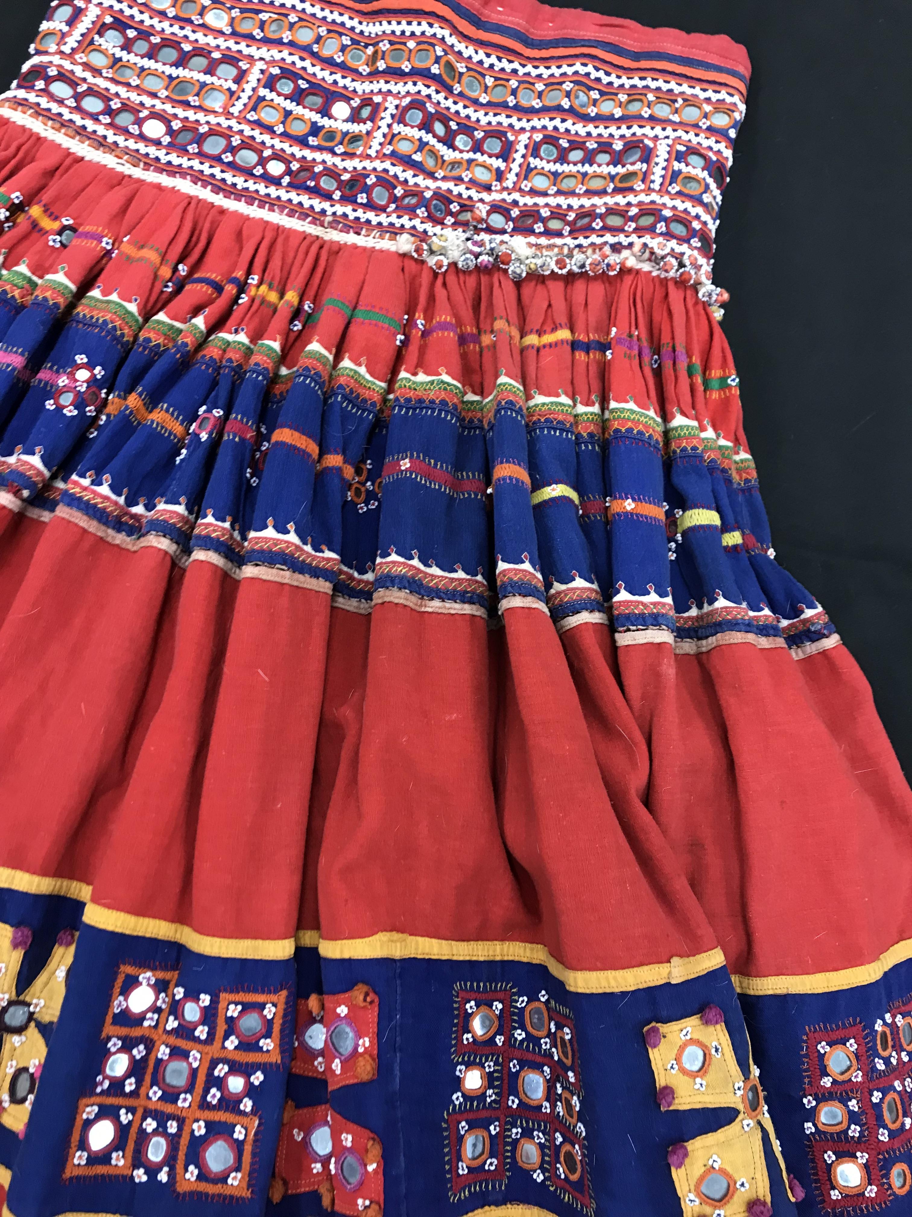 A Rajhistani skirt in red and blue stripes with overlaid embroidery and mirrored decorations, - Image 5 of 14