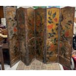 An 18th Century Continental embossed and painted leather six fold screen decorated with birds