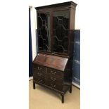 An early to mid 20th Century mahogany bureau,