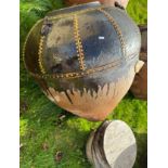 A modern teak treacle glazed terracotta plant pot of large proportions with frog decoration to the