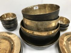 A collection of three beaten bronze deep bowls 28 cm diameter - 23.