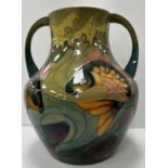 A large Moorcroft pottery carp pattern two-handled vase designed by Sally Tuffin circa 1990,