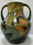 A large Moorcroft pottery carp pattern two-handled vase designed by Sally Tuffin circa 1990,
