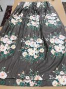 Two pairs of cotton satin curtains with green and pink floral design on a brown ground, lined,