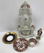 A Victorian Staffordshire pottery stoop or holy water group,