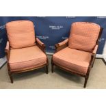 A pair of Wesley Barrell double caned bergère armchairs with upholstered cushions and arm rests