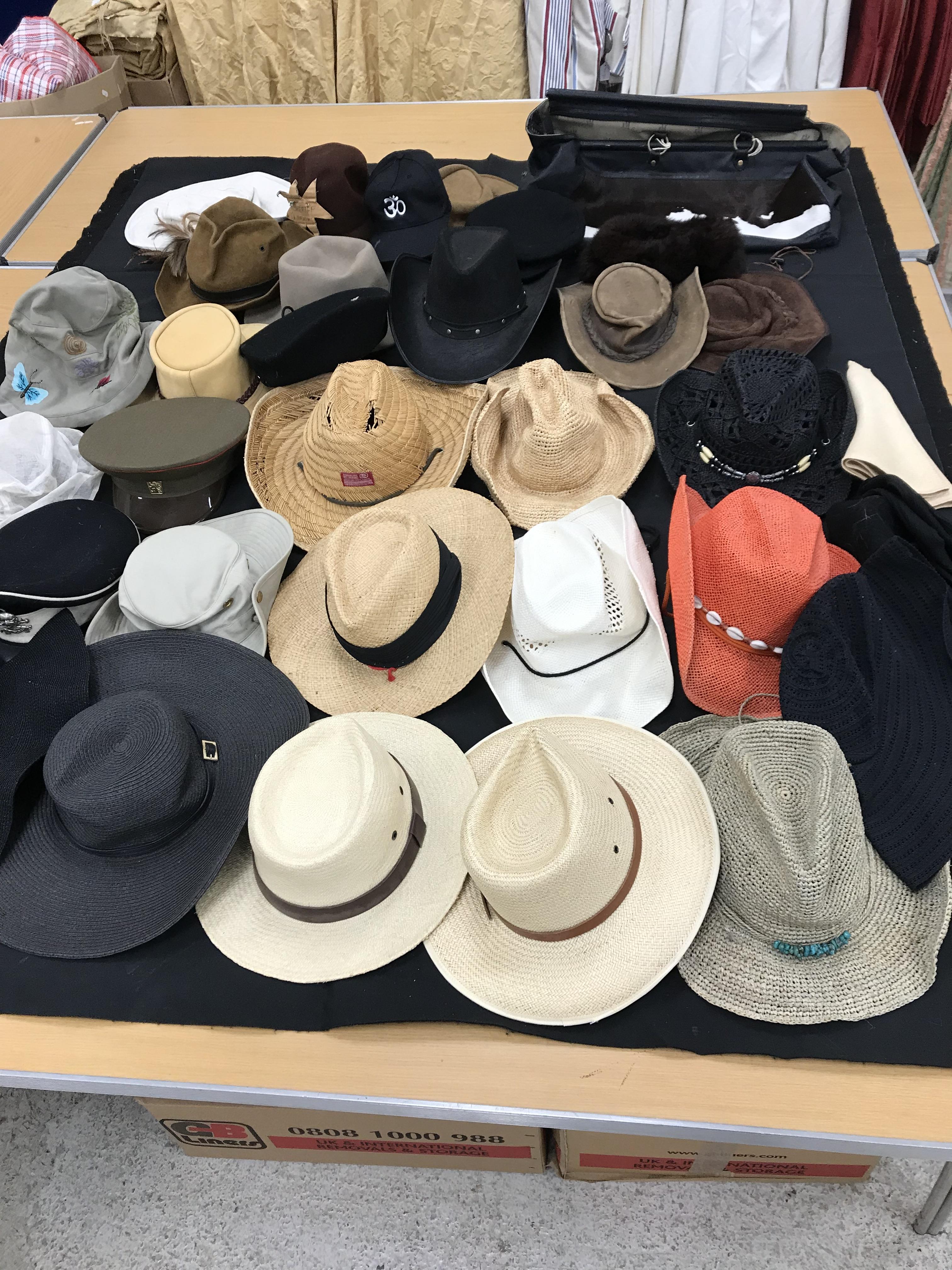 A box containing 37 assorted hats,