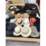 A box containing 37 assorted hats,