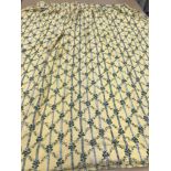 One pair of cotton type curtains with a yellow and green foliate trellis design and single green