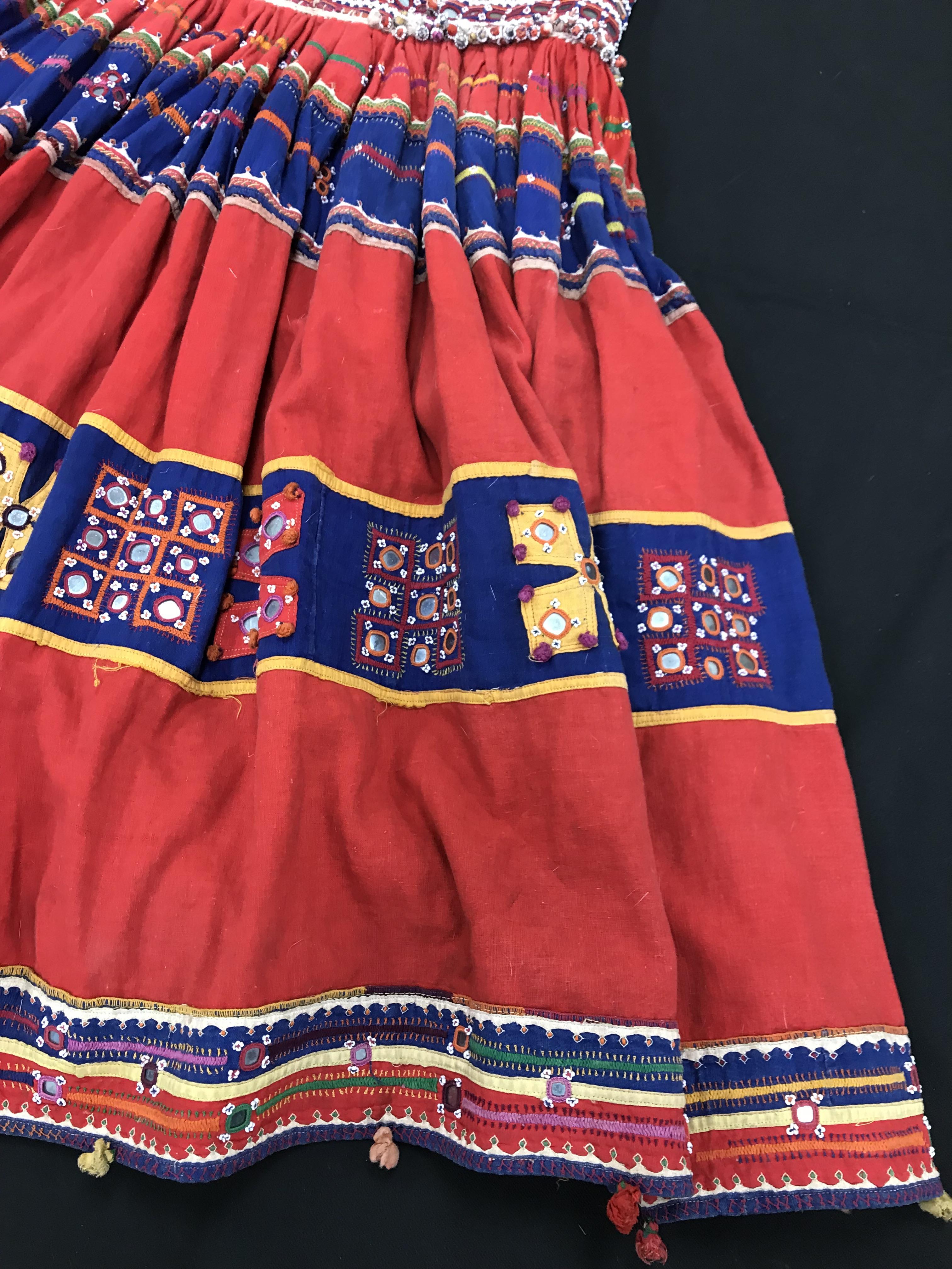 A Rajhistani skirt in red and blue stripes with overlaid embroidery and mirrored decorations, - Image 6 of 14