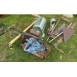 A collection of various vintage tools including silage knife, two handled saw, scythe, ladle, yoke,