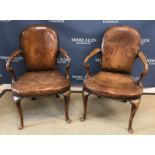 A pair of early to mid 20th Century walnut framed elbow chairs in the early 18th Century manner