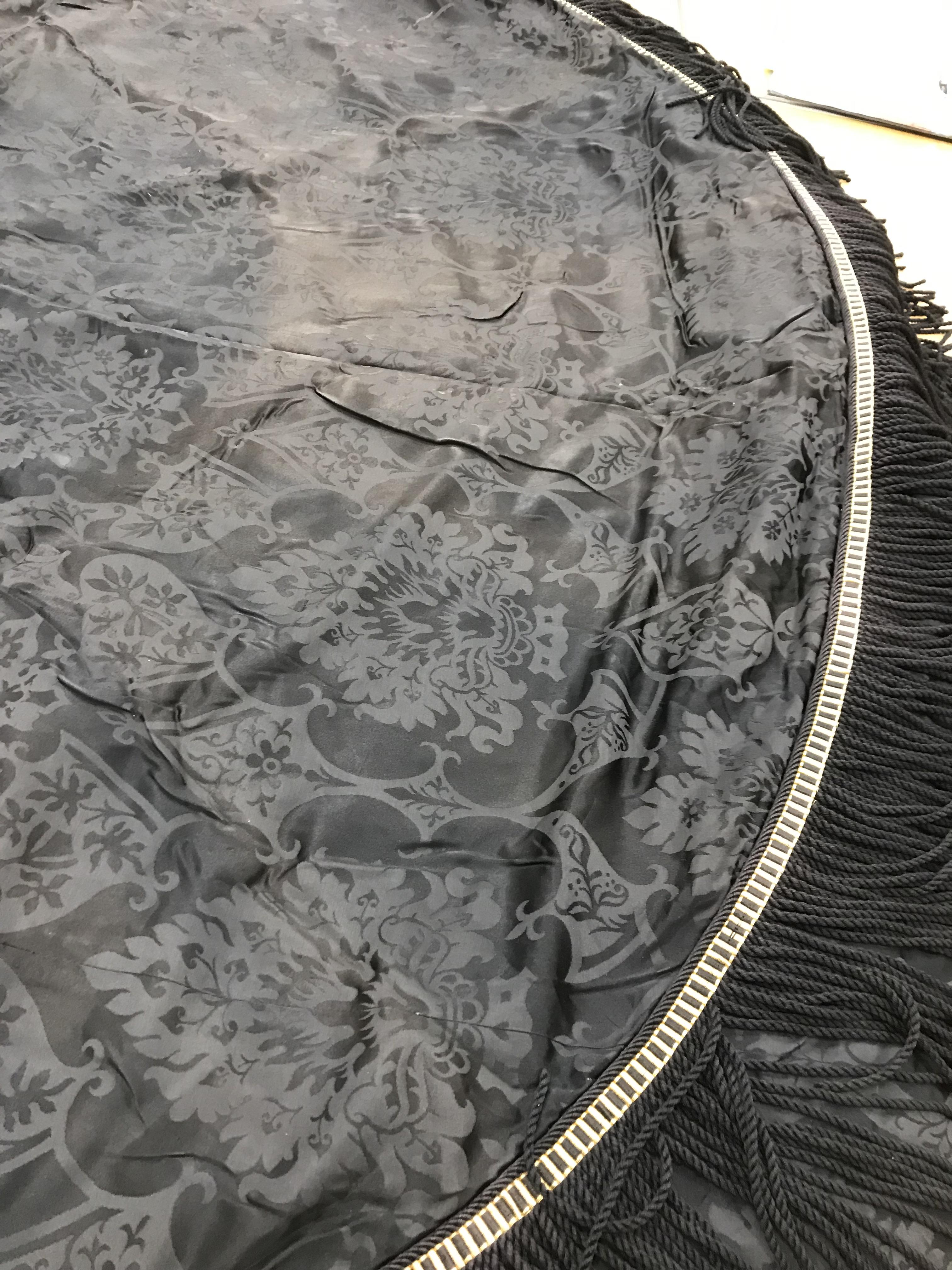 Four black damask circular tablecloths with black and gold braid and fringing, - Image 13 of 21