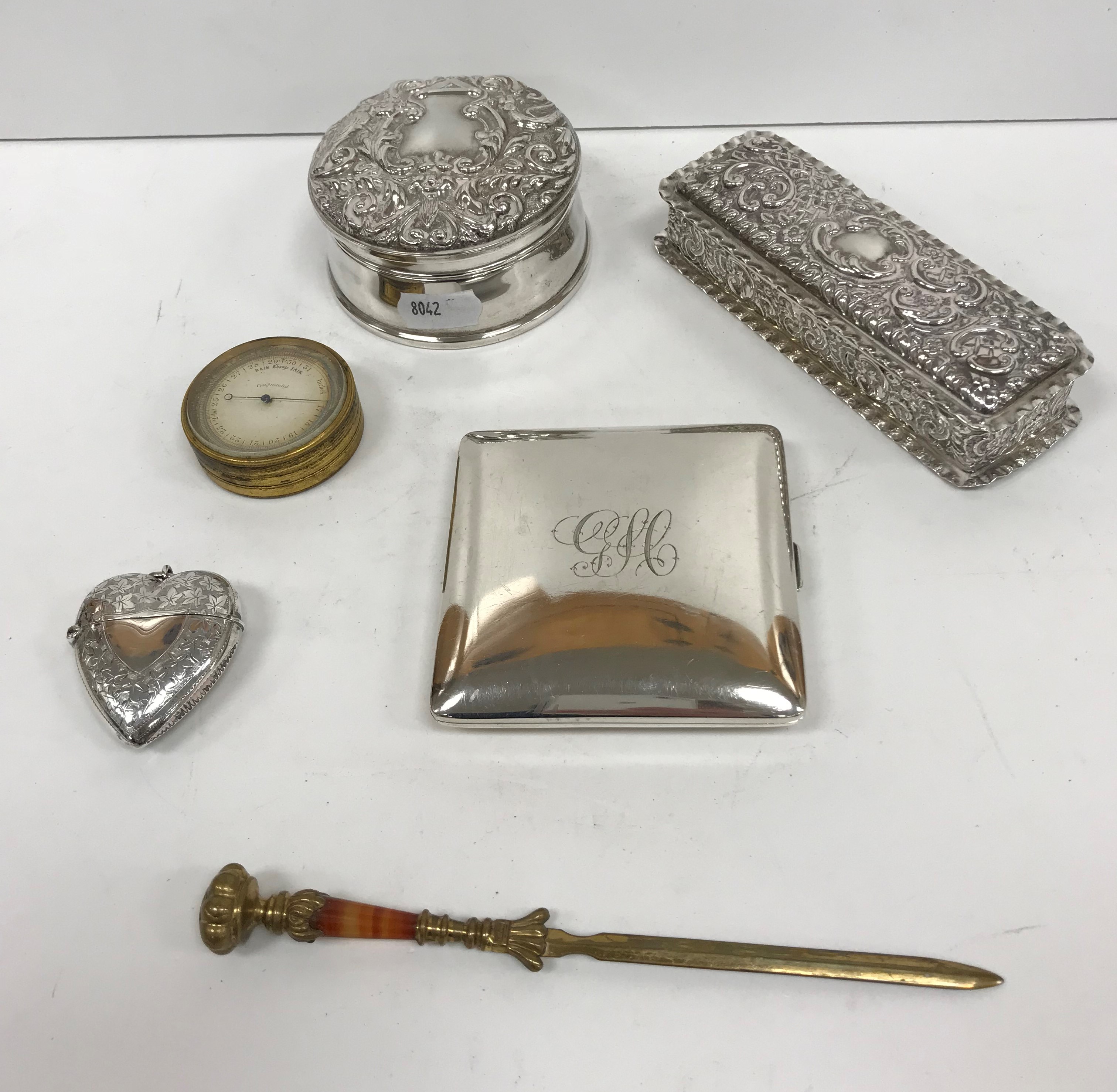 A collection of small silver wares to include a late Victorian silver loveheart shaped vesta case