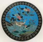 A Chinese cloisonné charger decorated with two cranes feeding amongst blossoming foliage 30.