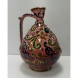 A circa 1900 Zsolnay, Pecs relief work decorated ewer, bearing TJM mark for Terez,