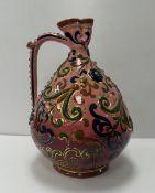 A circa 1900 Zsolnay, Pecs relief work decorated ewer, bearing TJM mark for Terez,