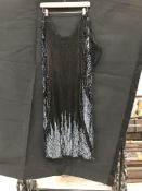 A black beaded cocktail dress, together with a black beaded and sequinned top by Batik,