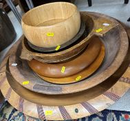 A collection of various treen ware to include eight various bowls and dishes,