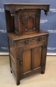 A 20th Century oak court cupboard in the 17th Century manner,