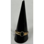 An unmarked yellow metal seal ring set with oval cut bloodstone, 3 g,