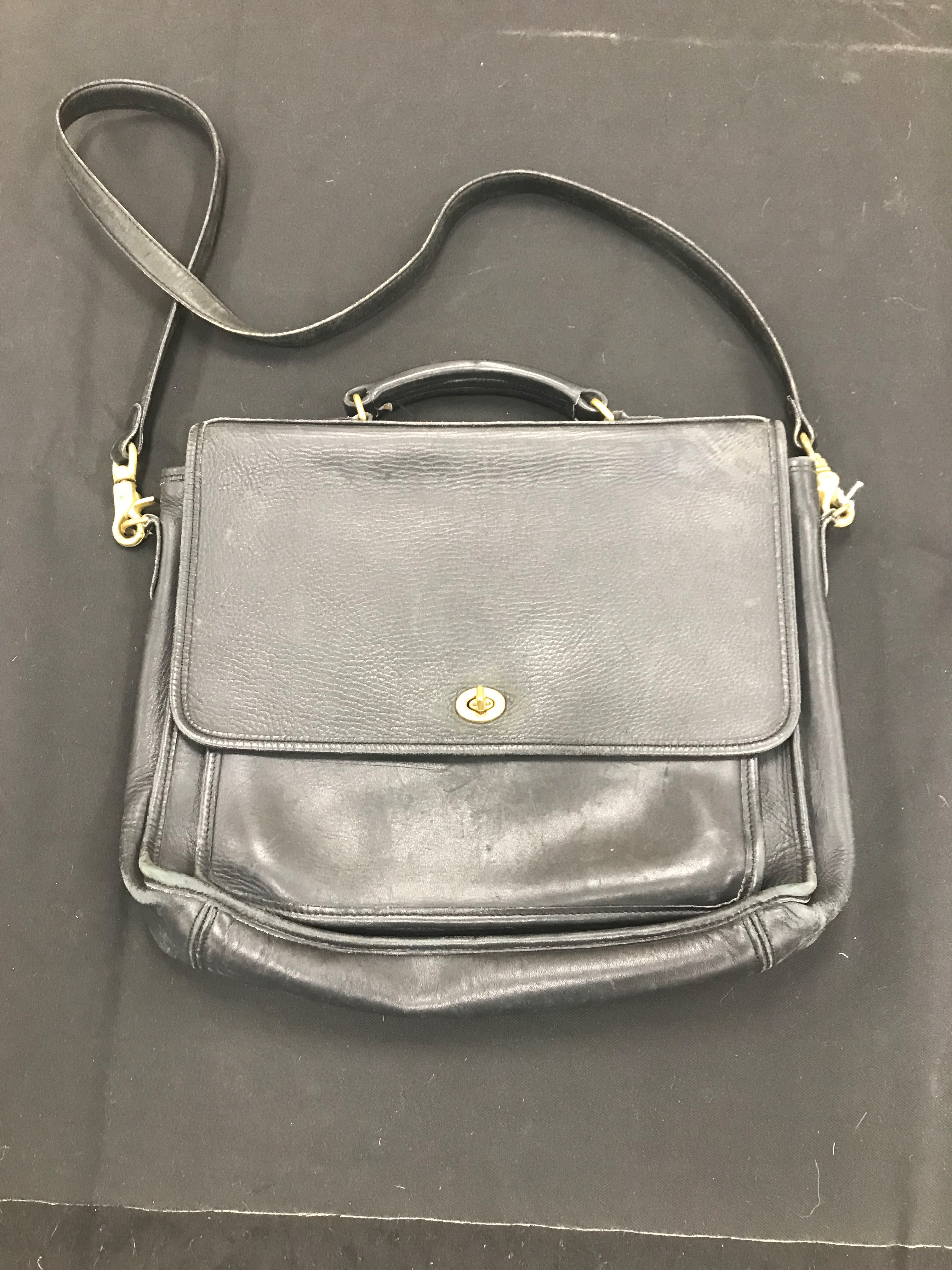 A black leather bag by Coach, No.