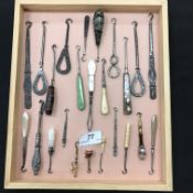 Five trays of various personal items including a tray of various button hooks including ones with