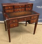 A Multiyork cherry wood writing table,