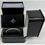 A platinum bracelet set with twenty-one brilliant cut diamonds each approx. .1 carat (2.