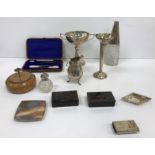 A box of small silver wares to include a baluster shaped cream jug on three scroll feet,