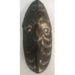 A Papua New Guinea (Sepik River) painted mask with shell eyes 42 cm