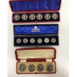A set of six cased silver buttons with floral decoration (by Joseph Gloster, Birmingham 1902),