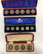 A set of six cased silver buttons with floral decoration (by Joseph Gloster, Birmingham 1902),