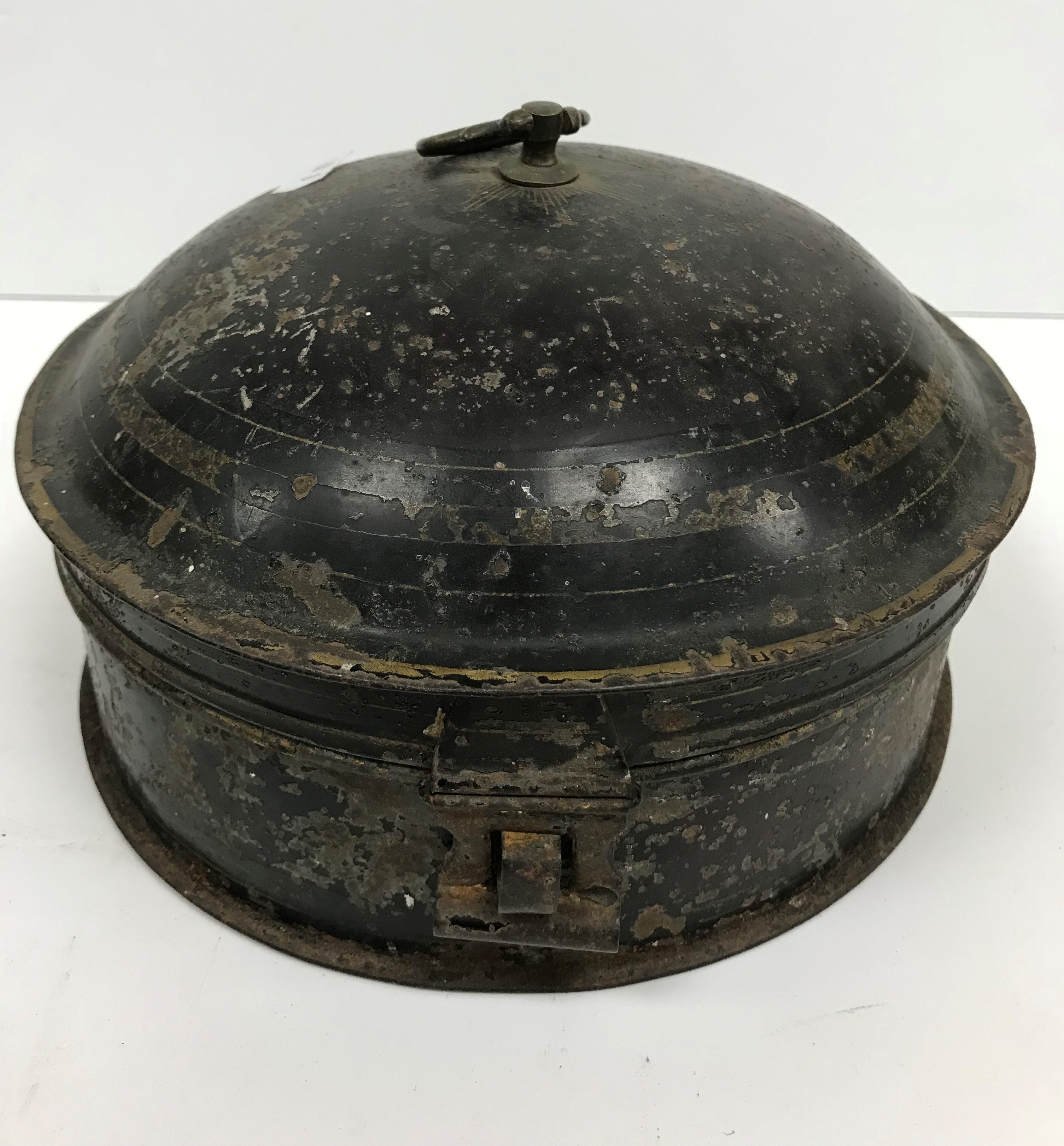 An early 19th Century tole ware painted and gilded dome top spice tin of circular form,