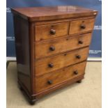 A Victorian mahogany chest of two short over three long graduated drawers with turned knob handles