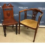 A late Victorian mahogany panel seated hall chair and an Edwardian yoke back elbow chair on square