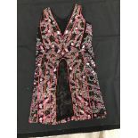 A black silk evening top, heavily beaded with pink, red, white and clear glass beads,