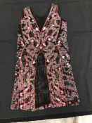 A black silk evening top, heavily beaded with pink, red, white and clear glass beads,