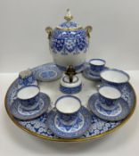 A late Victorian Copeland Spode blue and white and gilt decorated coffee set with central pot on a